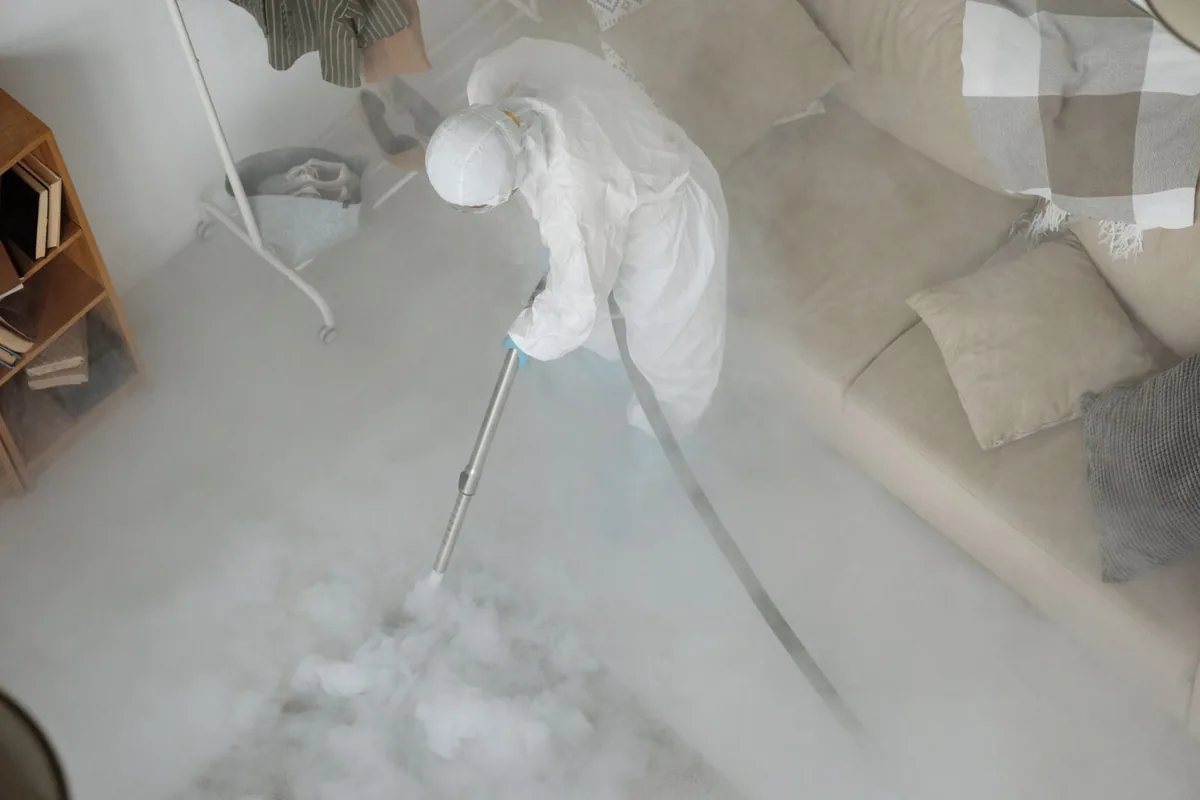Biohazard cleanup technician in protective equipment, Espy, PA